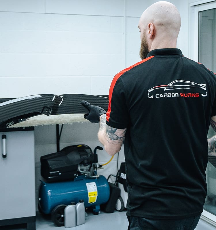 Inspecting The Carbon Fibre Part To Be Repaired