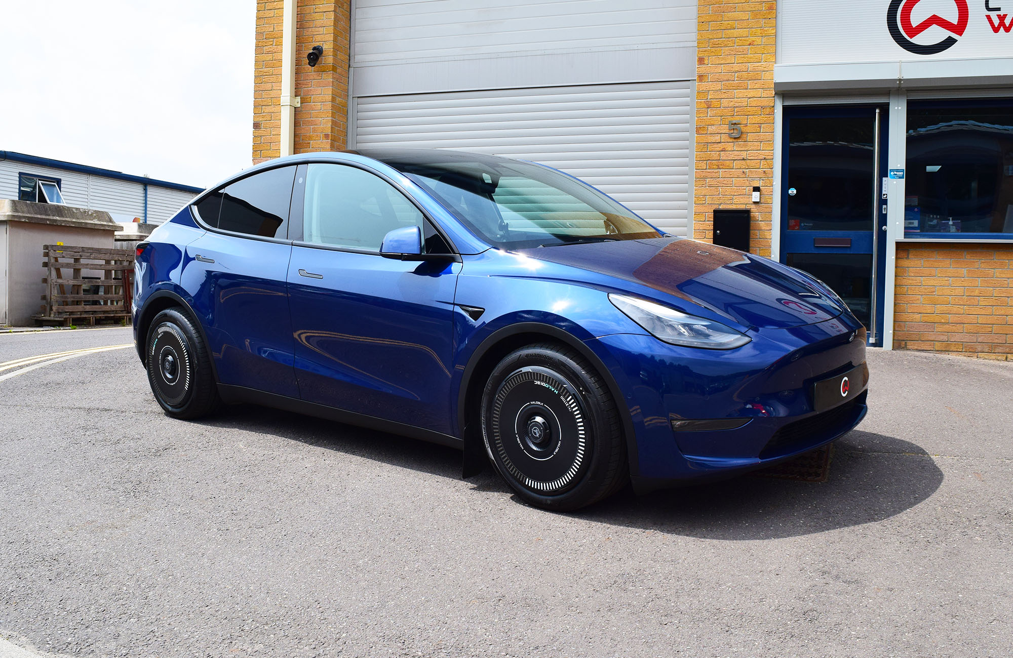Tesla Model Y fitted with Mountain Pass Performance camber arms, front bushings and KW coilovers by Carbonwurks
